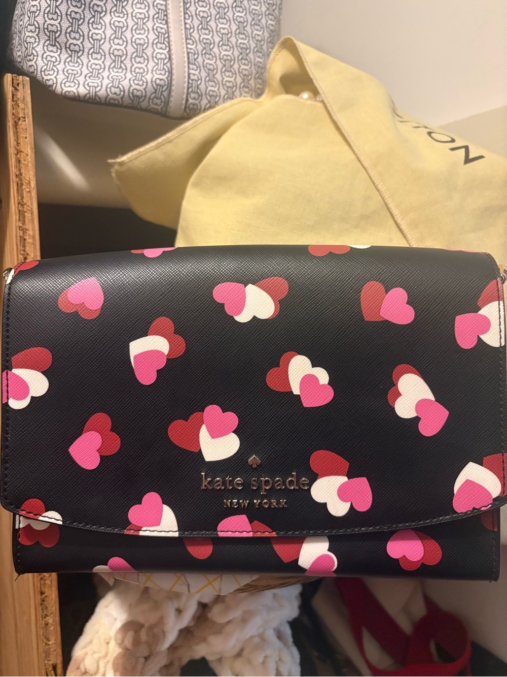 kate spade black shoulder bag with pink, red, and white heart print